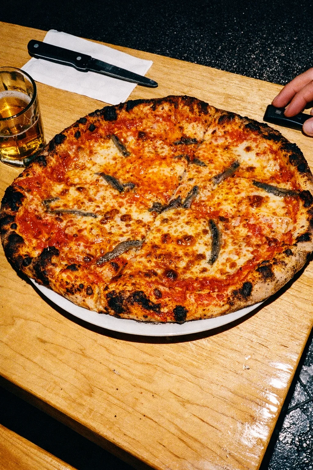 Pepperoni basil pizza with Pizza Cantina table card