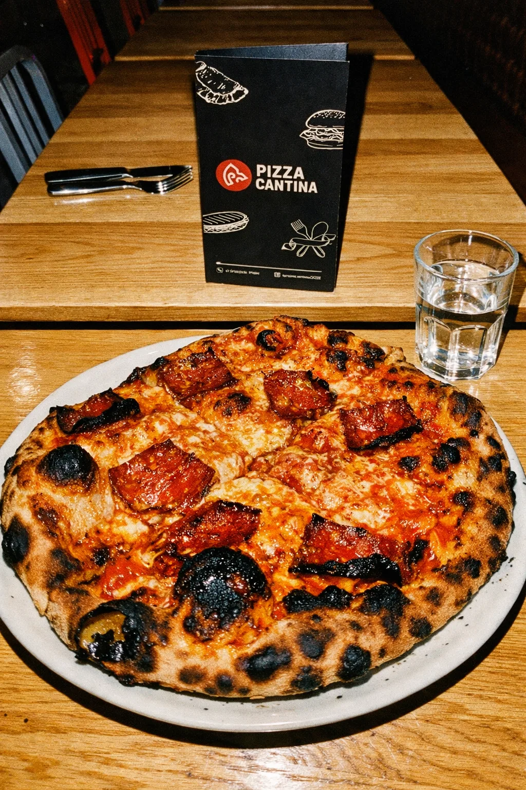 Signature bacon pizza in Pizza Cantina dining room